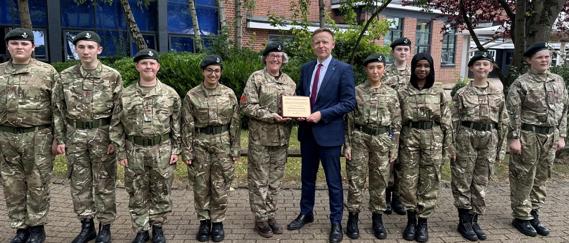 Summit Learning Trust CEO Vince Green with learners and the armed forces