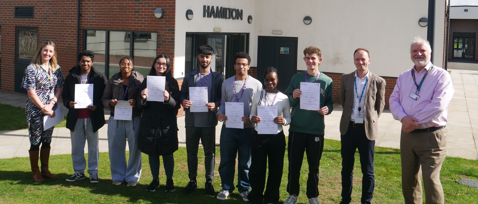 A level Chemistry students at Solihull Sixth Form College pick up certificates from Principal Martin Sullivan for success in the Cambridge Chemistry Challenge