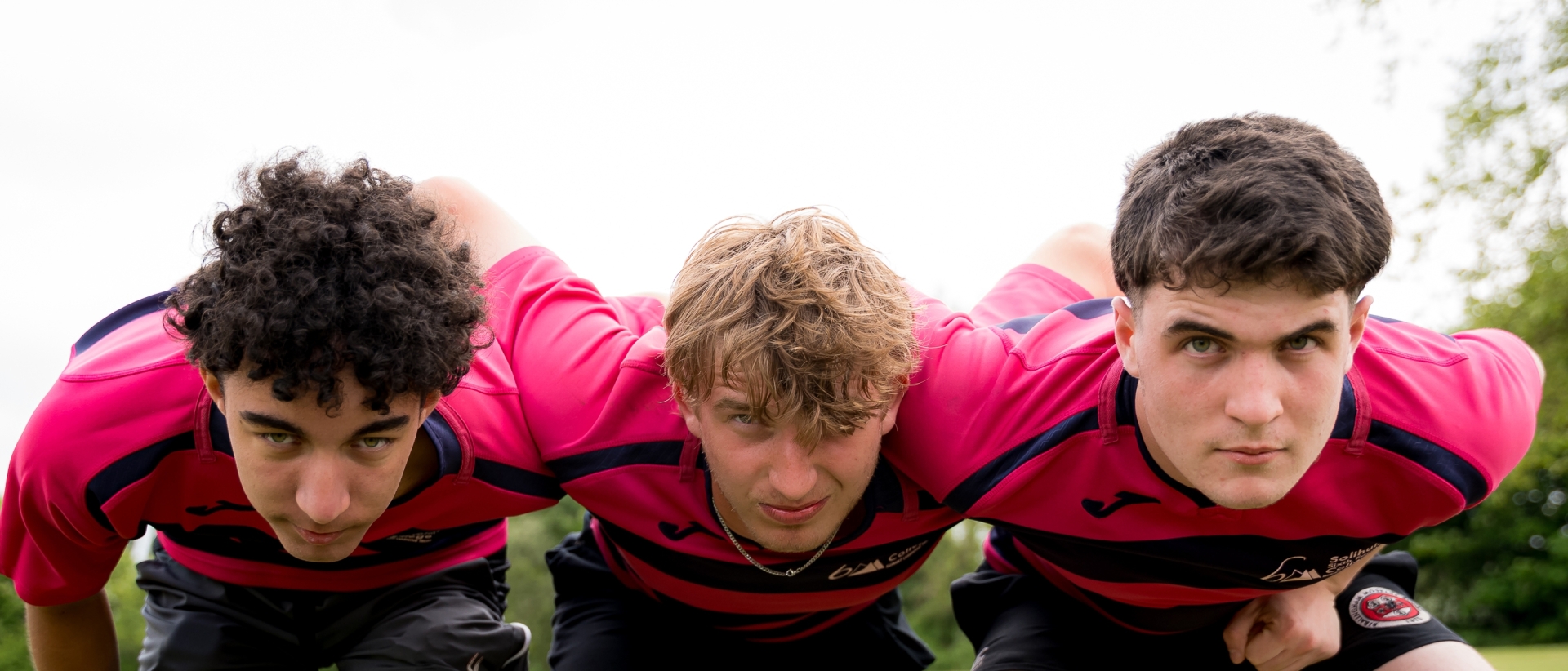 Students in a rugby scrum at Solihull Sixth Form College